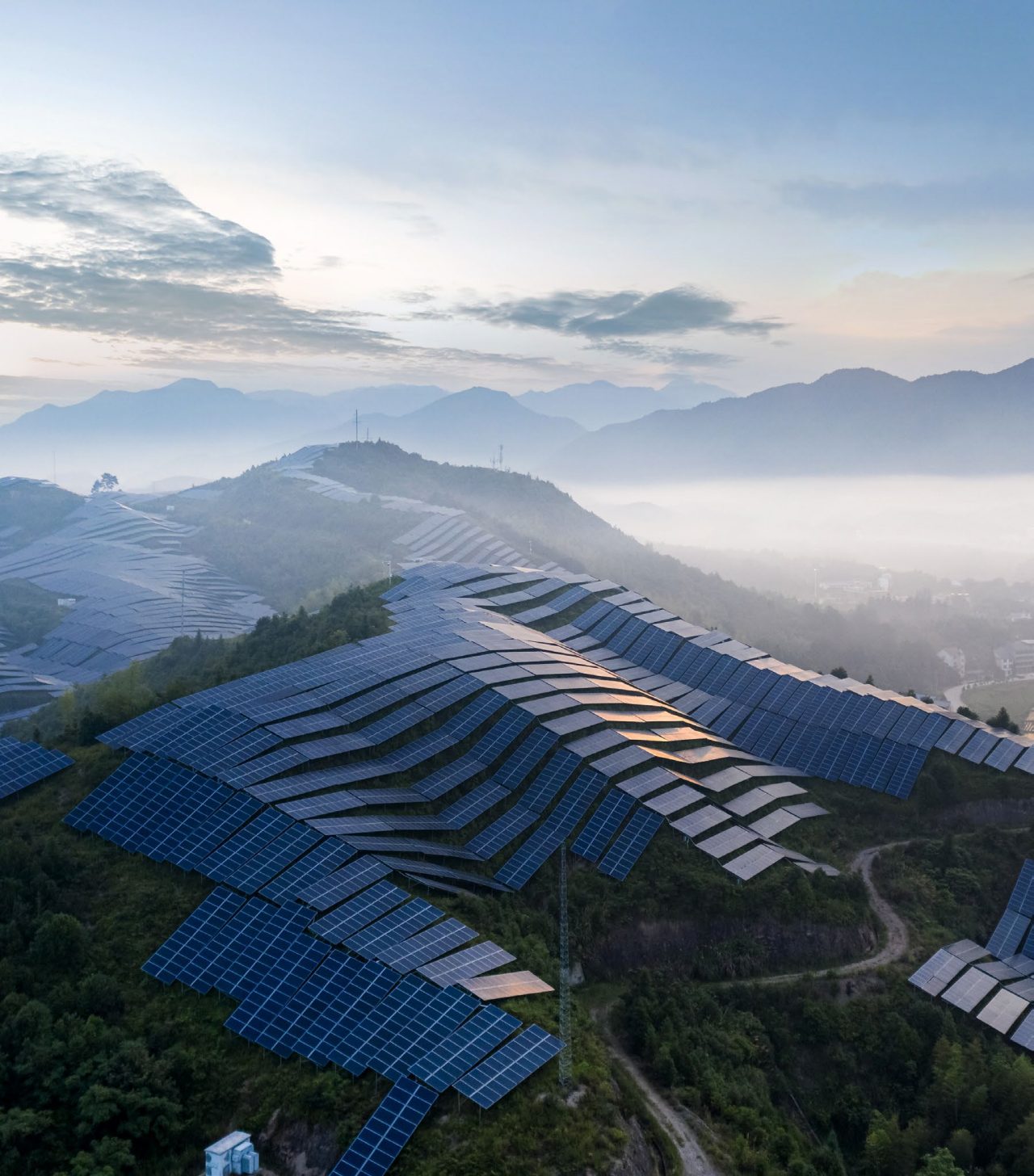 A solar power plant on the top of a mountain in the morning mist in Nanping City, Fujian Province, China.
